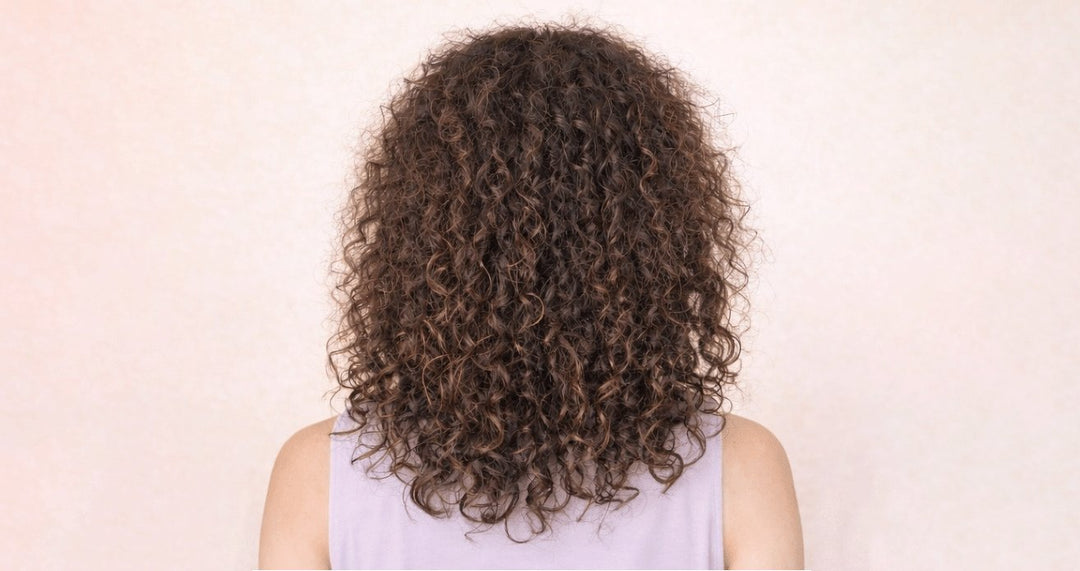 Curly hair frizz before Glazy Cloud capsule treatment
